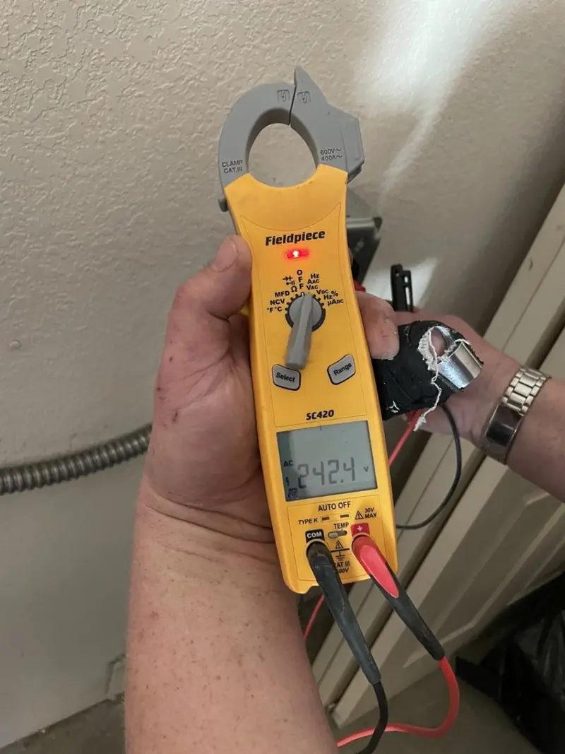 Voltage testing with clamp meter during Recessed Lighting Installation in Clemson University